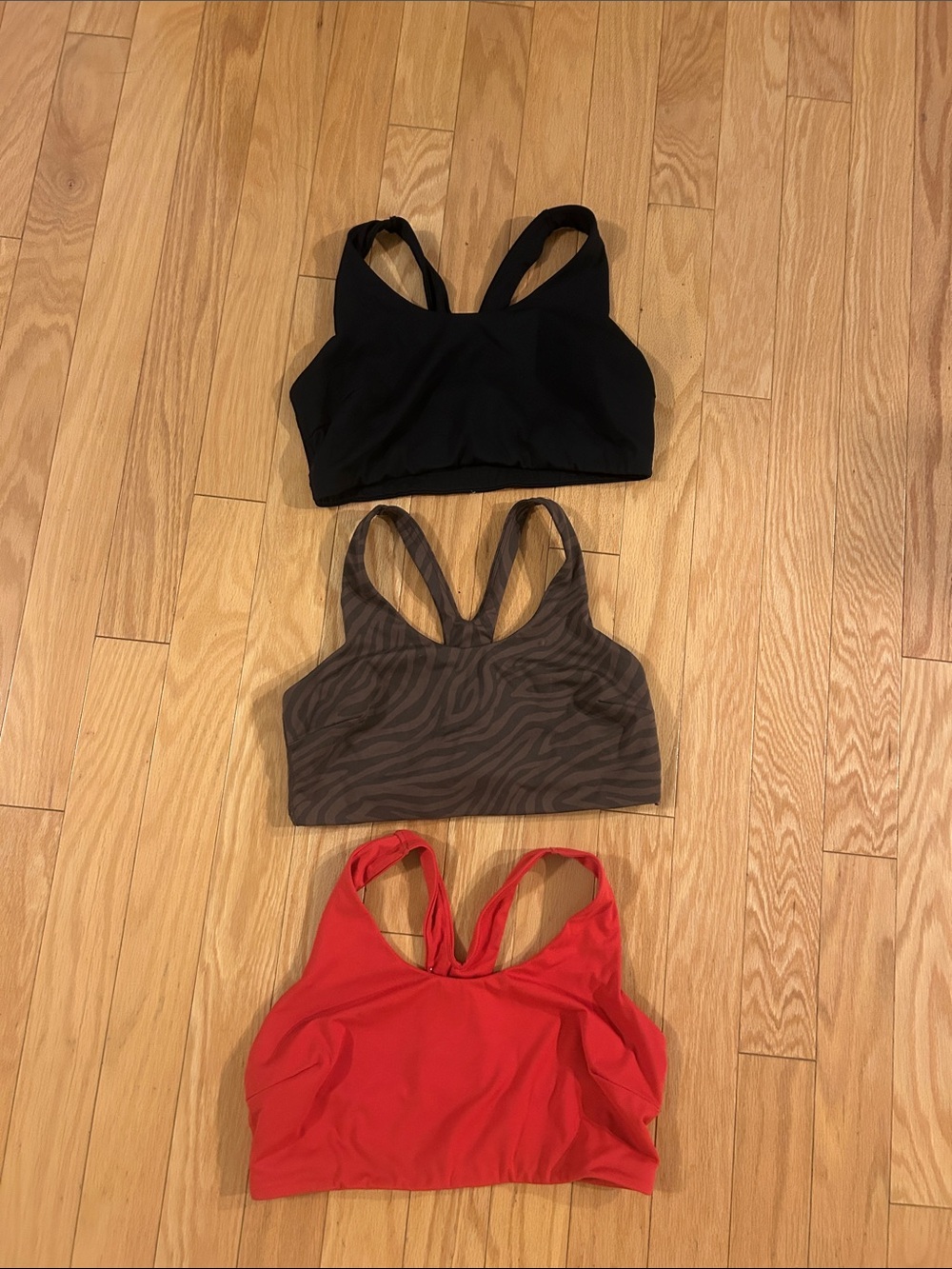 all in motion Women’s 3-Pack Sports Bras - Black, Brown Zebra, Red